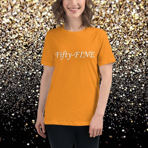 A woman wearing an orange t-shirt with the word " fifty five " written in white.