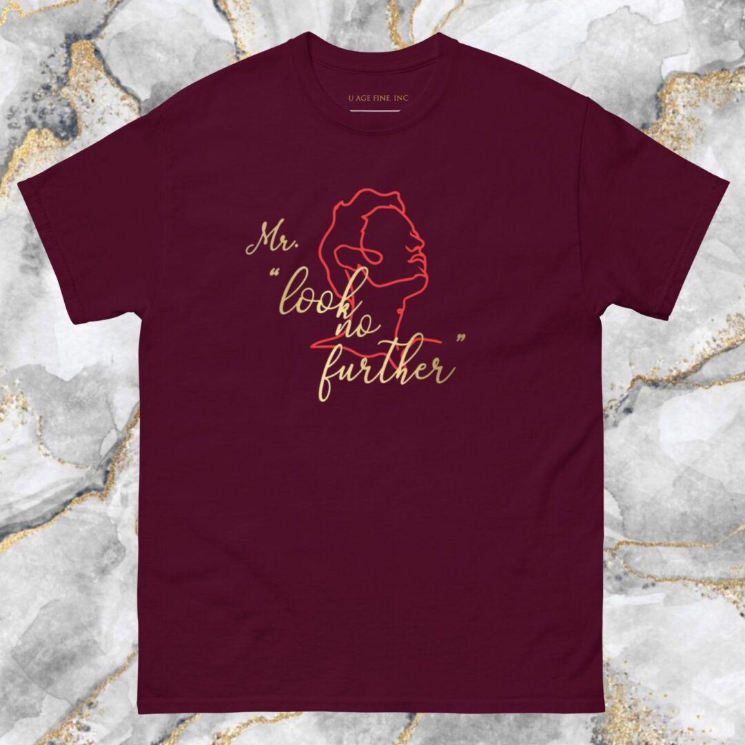 A maroon t-shirt with the words " my love is far from " written in gold.