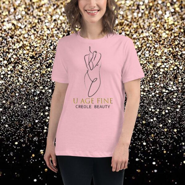 A woman wearing a t-shirt with the words peace, love and smile beauty written in gold.