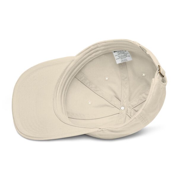 A beige hat with a white logo on it.